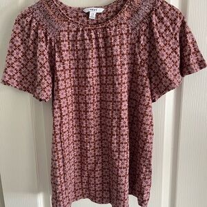 NEXT, size 10 UK, pink/magenta t-shirt with light brown pattern